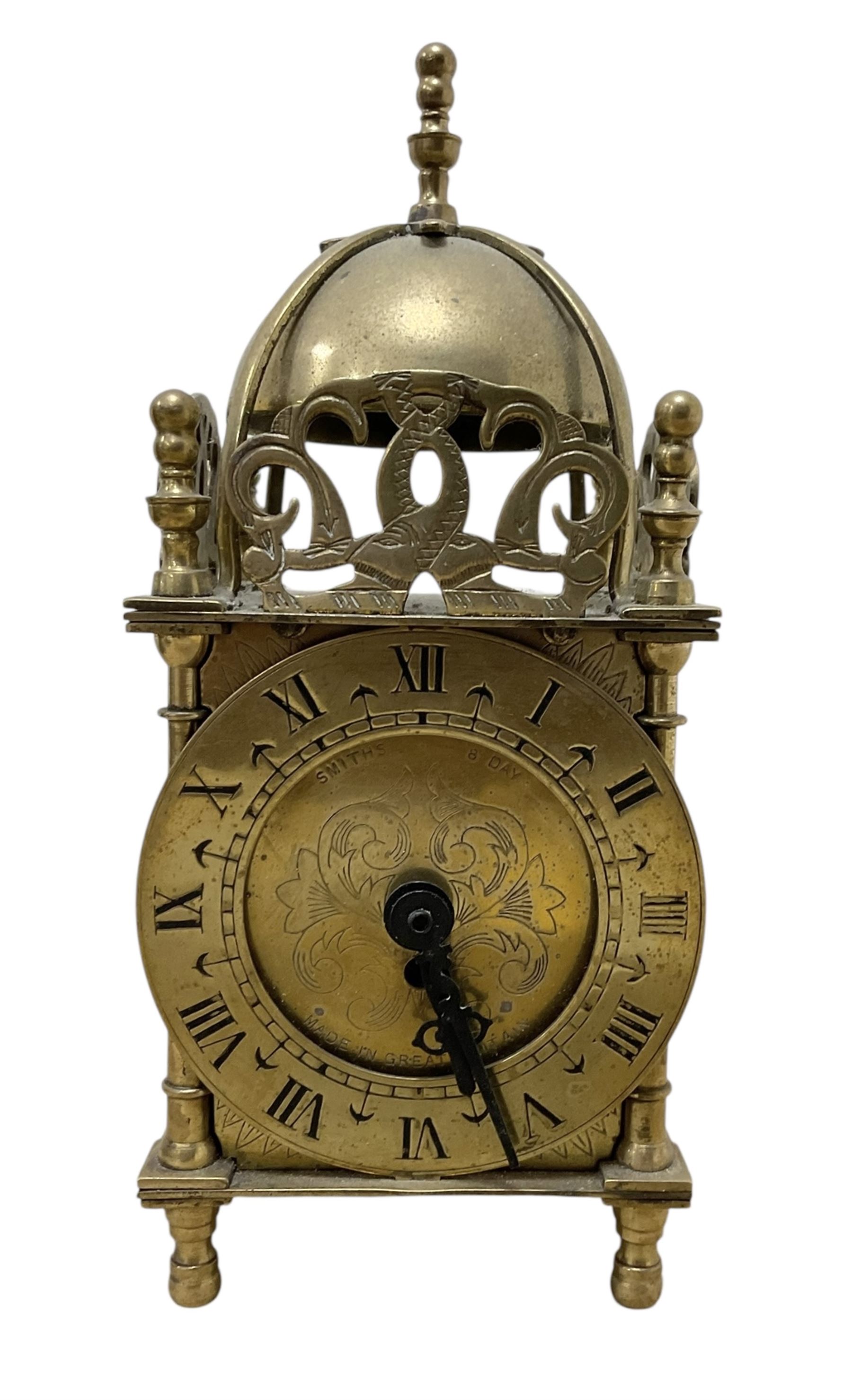 Two 29th century reproduction German traveling clockmaker figures and a small battery operated miniature lantern clock