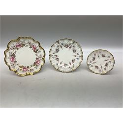 Coalport Revelry pattern tea and dinner wares, comprising nine dinner plates, four salad plates, eleven side plates, sauce boat and stand, ten teacups and ten saucers, and preserve pot and cover, together with a Coalport plate of shaped form decorated with pink roses, and a Royal Crown Derby Royal Antoinette pattern trio
