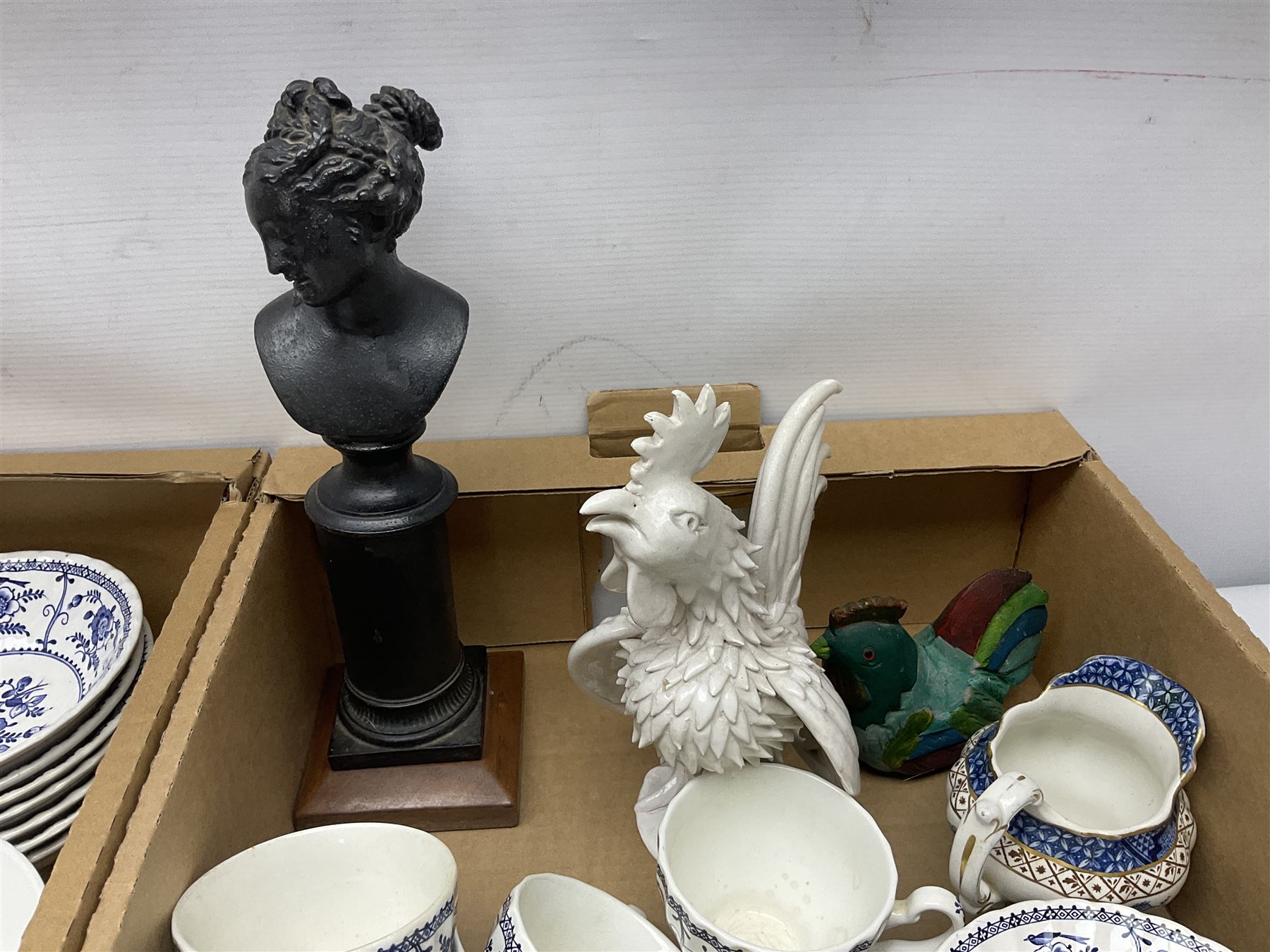 Johnson Bros Indies pattern tea and dinner wares, painted metal female bust on wooden plinth, three radios including one Roberts, Zenit B camera body, Polaroid 1000 land camera, Lorus wristwatch, and other ceramics etc, in four boxes