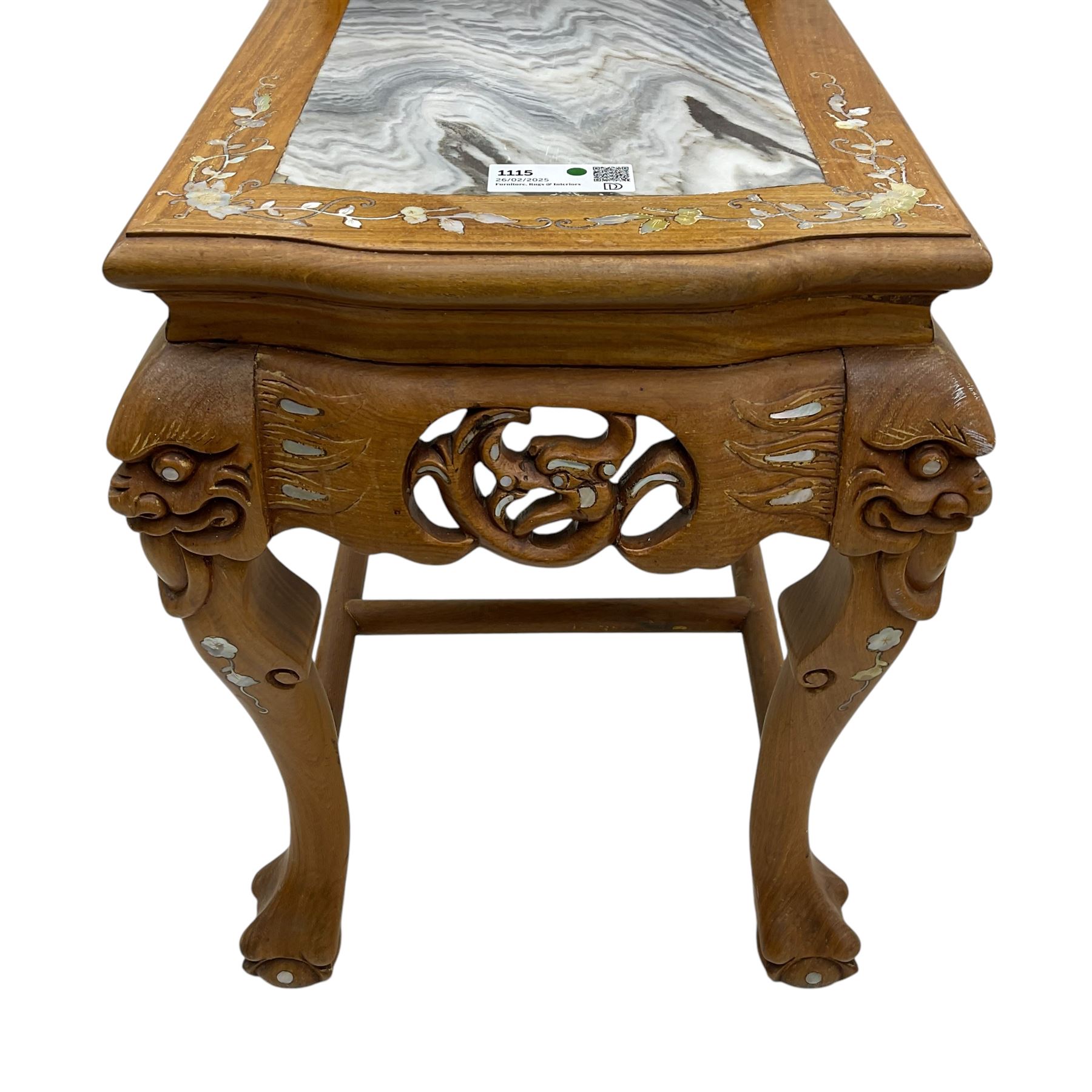 Pair of Chinese hardwood side or end tables, two moulded tiers with grey marble insets, inlaid with trailing foliate motifs in mother of pearl, with scrolling fretwork frieze rails, on cabriole supports with ball and claw feet united by plain stretchers 