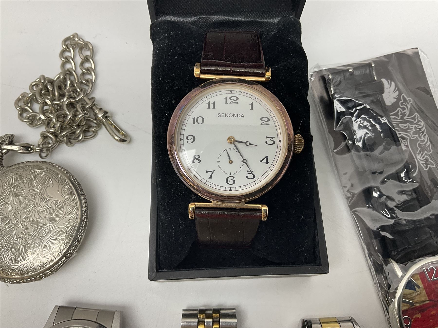 Three Sekonda wristwatches, together with other wristwatches, enamel badges and collectable badges