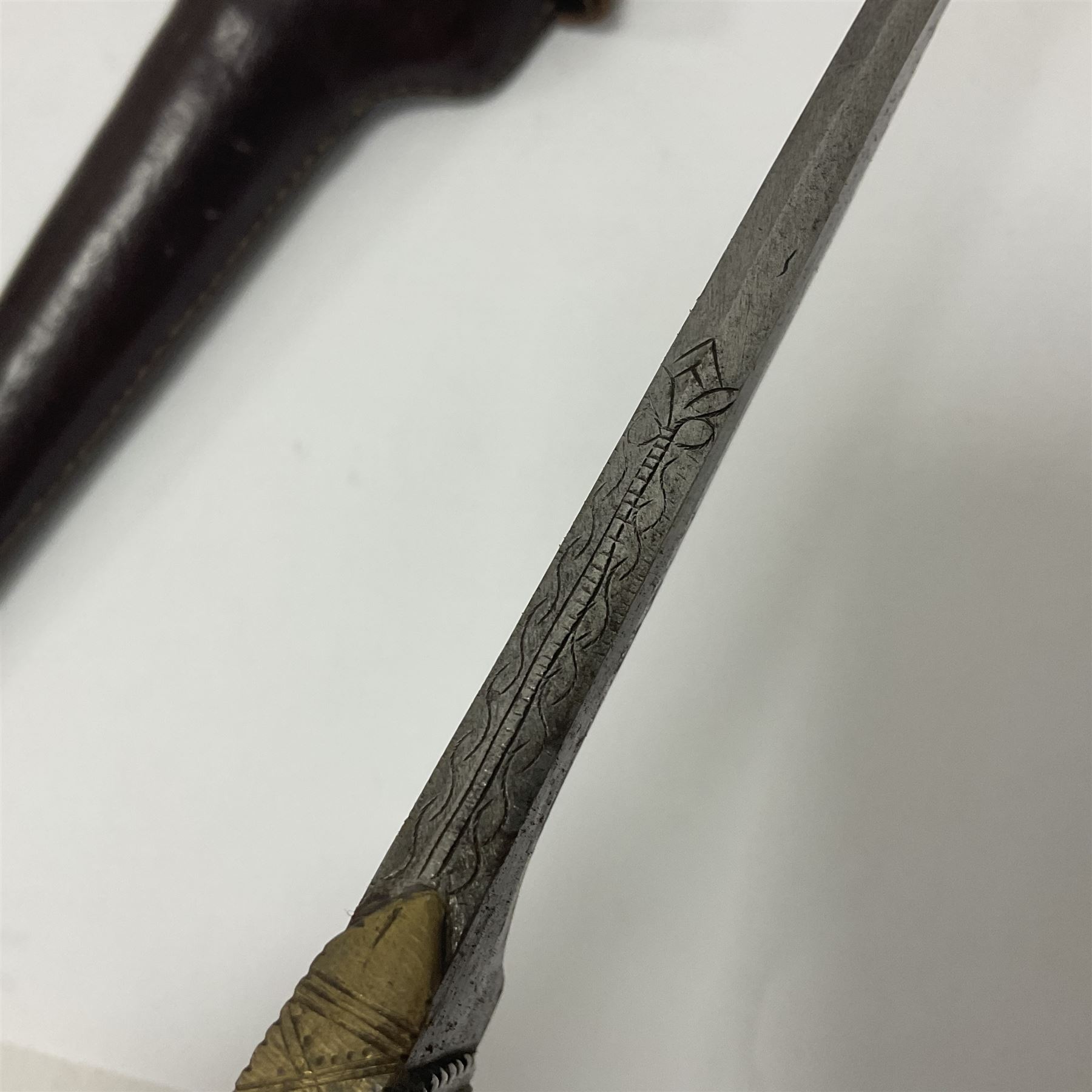 Afghan Khyber knife (Choora), blade engraved along the top edge with ornate brass and bone grip, with leather scabbard, overall L31cm, blade L20cm