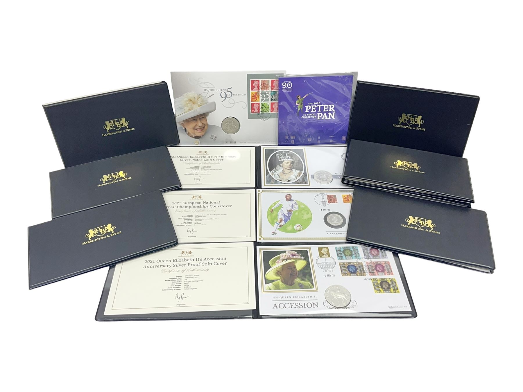 Commemorative coins and covers, including '80th Anniversary of the Battle of Britain' coin cover with Solomon Islands 2020 half dollar, 'Royal National Lifeboat Institution' coin cover with Alderney 2021 five pounds, 'Queen Elizabeth II's 95th Birthday' coin cover with Solomon Islands 2021 half dollar, other similar coin covers all in Harrington and Byrne folders, The Royal Mail 'HM The Queen's 95th Birthday' coin cover with 2021 five pounds and Queen Elizabeth II Isle of Man 2020 'Peter Pan' fifty pence coin collection in card folder