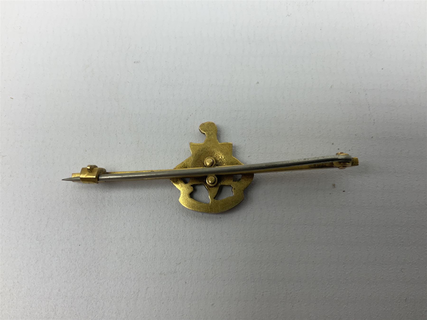 Royal Sussex Regiment 9ct gold sweetheart brooch with Regimental Association membership card to 6406670 Pte. Brock dated 1940; an 18ct gold pin badge enamelled with a shipping company (?) pennant; and an ARP button-hole badge (4)