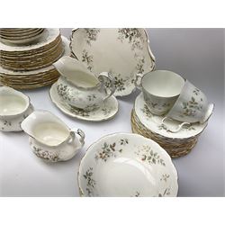 Royal Albert Haworth pattern tea and dinner wares, comprising eight dinner plates, ten salad plates, fourteen side plates, eight bowls, sauce boat and stand, pair of cruets, six tea cups and six saucers, cream jug, open sucrier, and cake plate. 