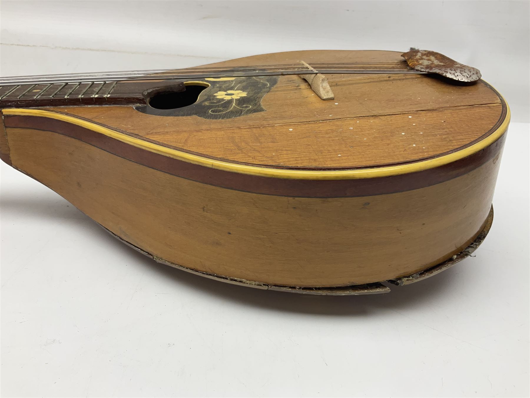 Italian eight-string mandolin with maple back and ribs and spruce top with inlaid floral marquetry panel within a fragmented mother-of-pearl border L61cm; cased; and a (damaged) German 'Michigan' mandolin for spares or repair (2)