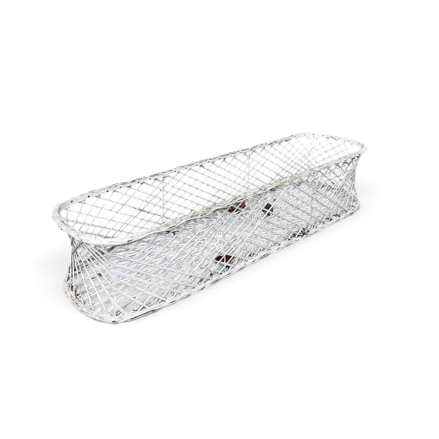 Four early 20th century French painted wicker garden planters, rectangular lattice form with shaped ends