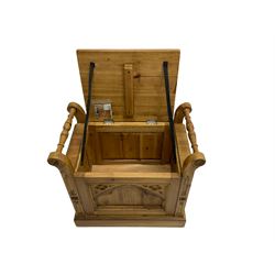 Gothic style pine stool with hinged box seat, decorated with flower head motifs, plinth base