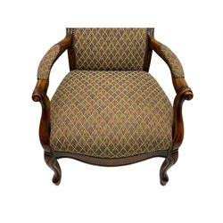 Stained beech framed open armchair, upholstered in foliate pattern fabric, on cabriole front supports