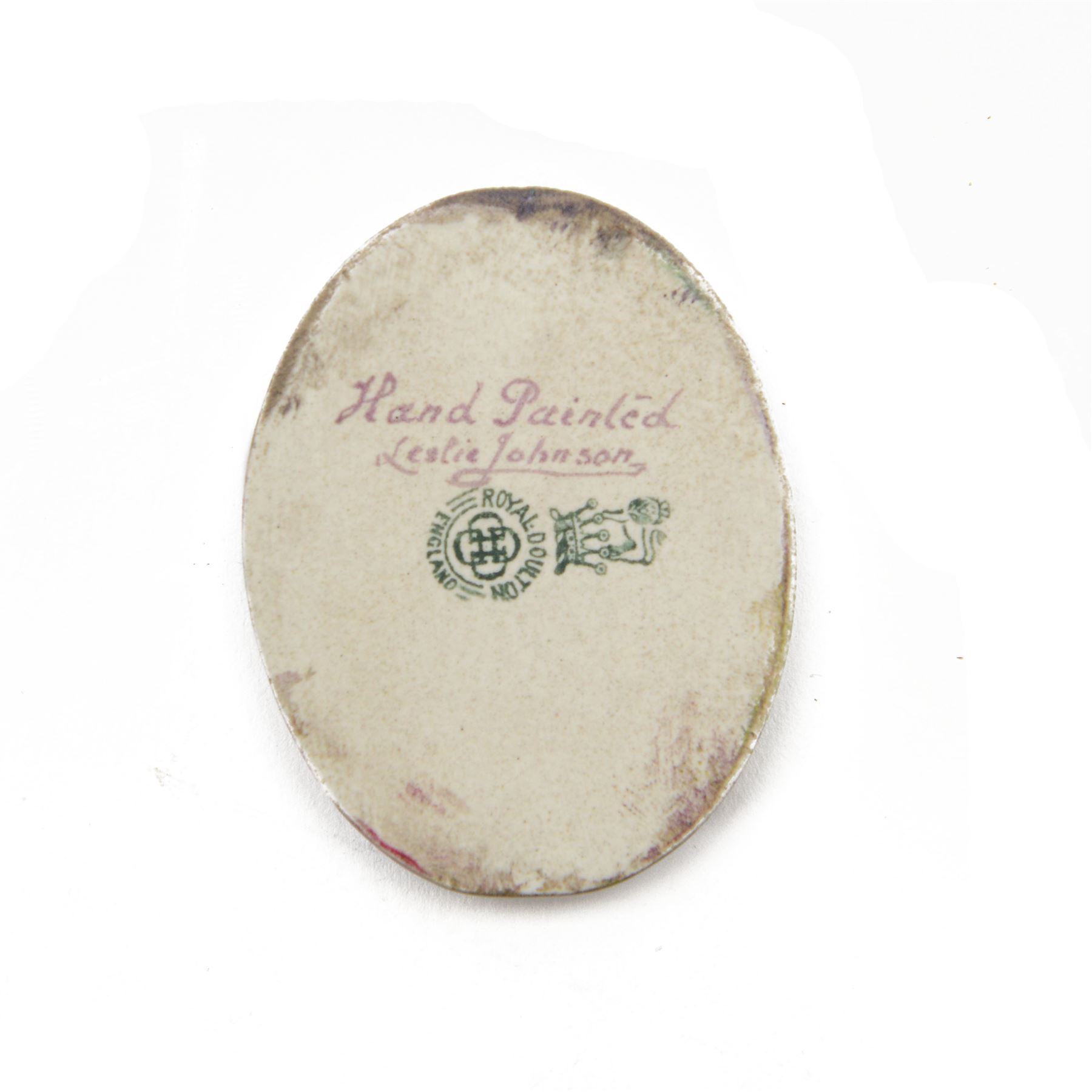 Royal Doulton porcelain plaque, hand painted with a portrait of a young woman, signed by Leslie Johnson, with printed backstamp verso, H5.5cm