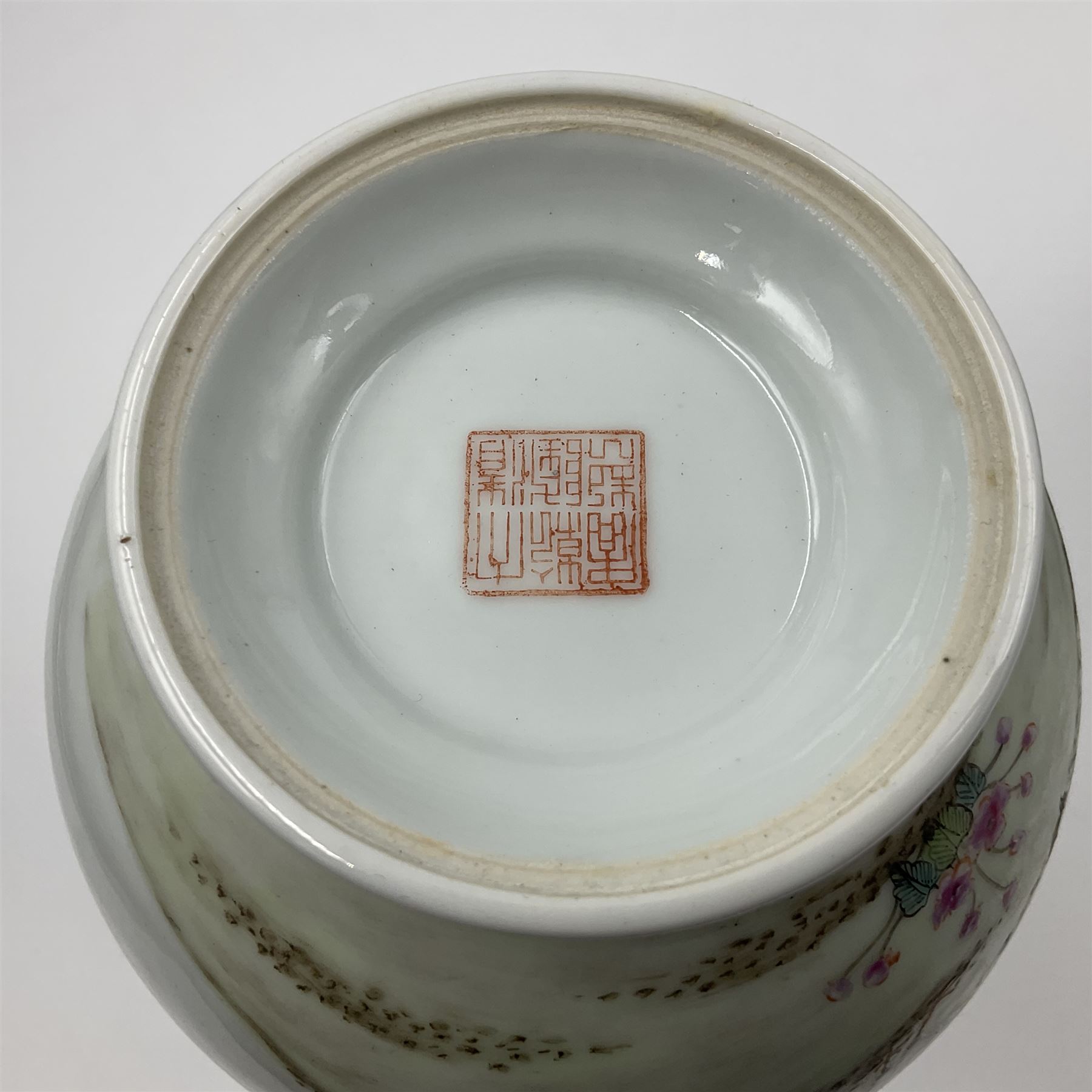 Pair of Chinese Republic porcelain vases, each painted in Famille Rose enamels with pairs of pigeons amidst peony, rock, flowering plants and leafy branches, possibly Qianlong seal beneath, H22cm 