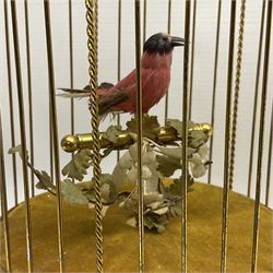 Swiss Reuge Music bird cage automaton music box, the bird with articulated head and beak, in a gilt brass cage, with a glass dome and stand, H30cm