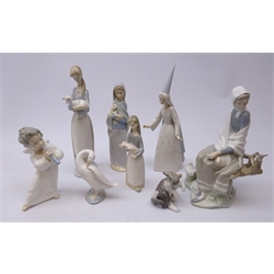  Eight Lladro figures comprising Shepherdess with bird on branch no. 4576, Fairy Godmother no. 4595, Shepherdess holding lamb, girl with calla lilies no. 4650, Angel with Flute no 4540, Girl with Pig, Cat and Mouse no 5236 and swan (8)  