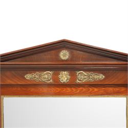 Rare pair of French Second-Empire neoclassical style mahogany mirrors with ormolu mounts, architectural pediment with central ormolu patera above flame mahogany frieze with honeysuckle flower and caryatid mounts, the frame with ormolu beading and bevelled mirror plates, flanked by turned columns with ormolu mounts above a reverse breakfront base, circa 1870