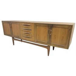 G-Plan – teak sideboard, four central drawers flanked by two double cupboards, enclosed by panelled doors 