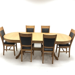 Oval solid oak extending dining table,  two turned columns on shaped supports joined by stretcher (W200cm and 250cm, H68cm, D101cm) and six oak framed chairs, upholstered back and seat (W44cm)