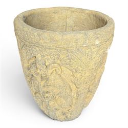 Cast stone Romanesque design urn of tapering form, decorated in relief with motifs of zoomorphic figures and swans within foliate and guilloche cast architectural arches with Neoclassical columns, in weathered finish