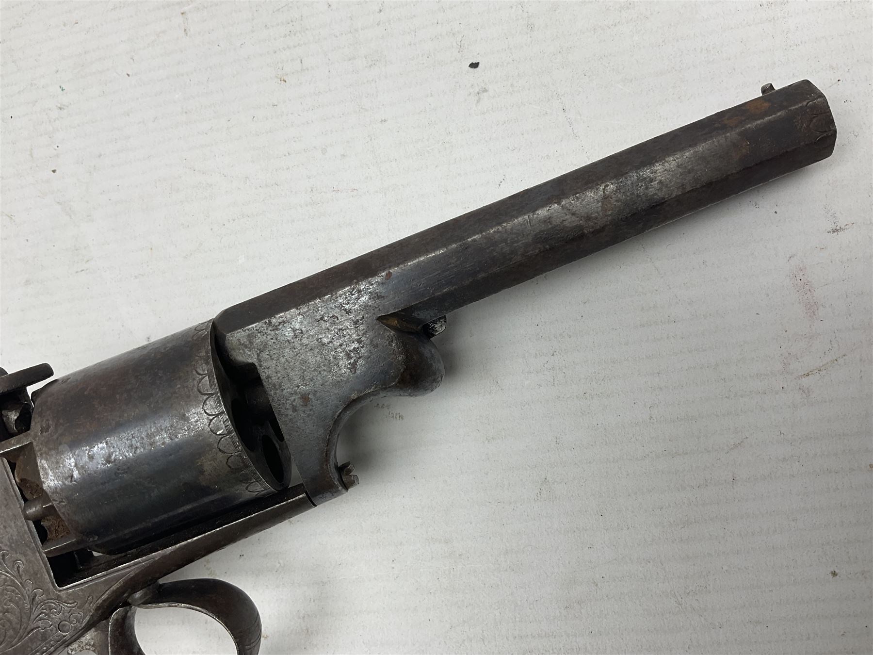 Mid-19th century Smith London .36 cal. transitional five-shot percussion revolver, the 12cm rifled octagonal barrel with side loading lever, side safety, some engraved decoration and chequered two-piece grip L28cm overall