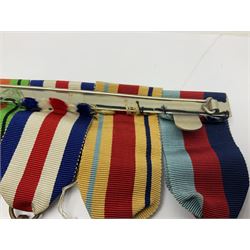 WWII group of five medals comprising 1939-45 War Medal, Defence Medal, 1939-45 Star, Africa Star and France and Germany Star on wearing bar; WWI British War Medal awarded to 142019 Pte. A. Thompson A.S.C.; and boxed King's Badge 'For Loyal Service'