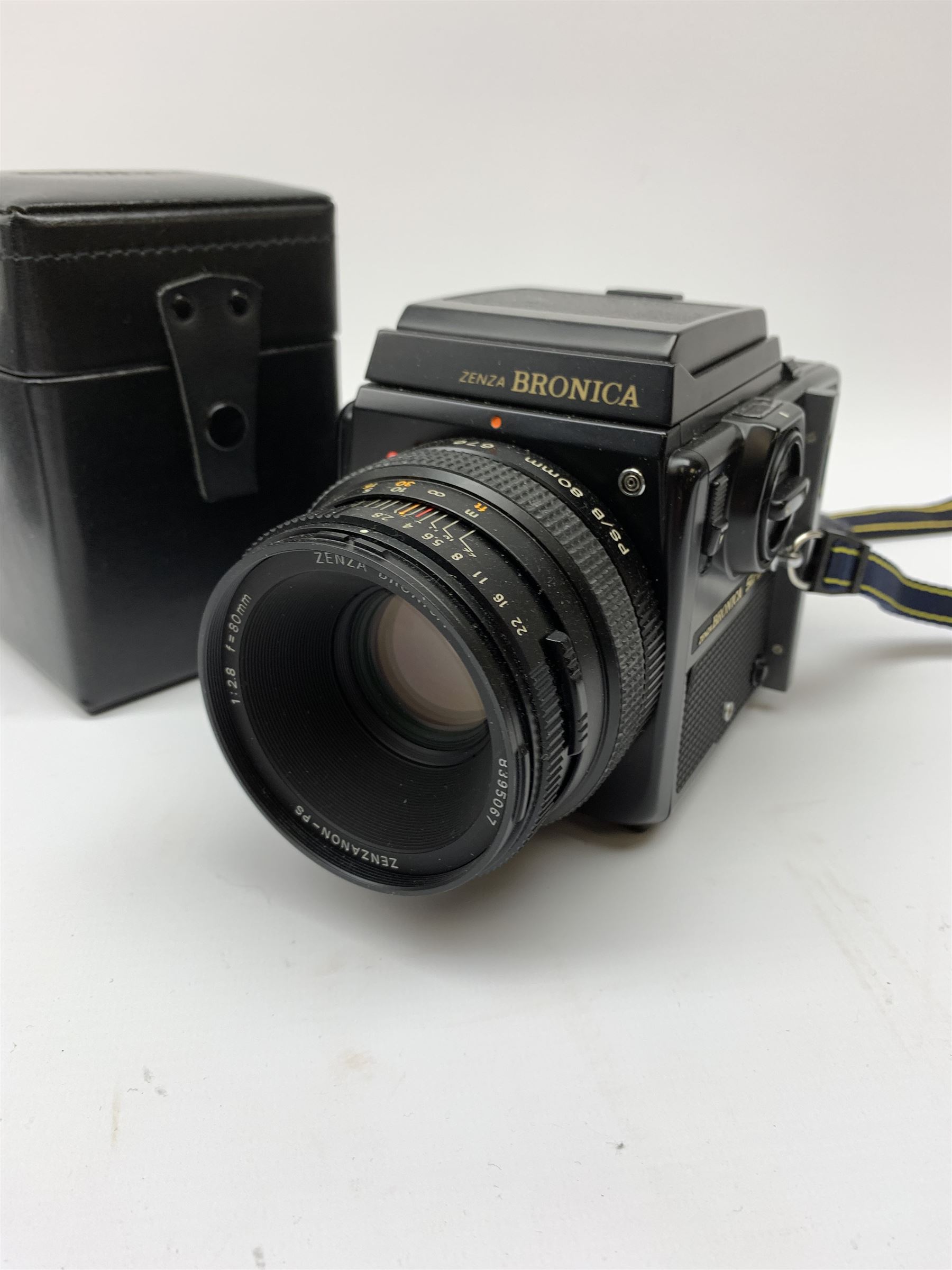 'Zenza Bronica SQ-B' camera fitted with 'Zenza Bronica Zenzanon-PS 1:28 f=80mm' lens, 'Zenza Bronica Zenzanon-PS 1:4 f=150mm' lens and 'Zenza Bronica Zenzanon-S 1:35 f=50mm' lens, with an instruction booklet