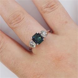 Platinum tourmaline and diamond three stone ring, single octagonal cut green tourmaline of approx 1.65 carat, with a round brilliant cut diamond set either side, stamped PT 950, total diamond weight approx 1.05 carat