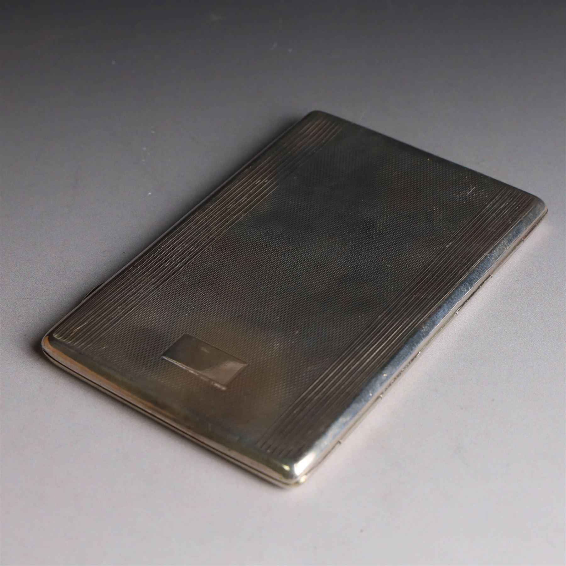 1920s silver cigarette case, with engine turned decoration and vacant cartouche, hallmarked Harman Brothers, Birmingham 1921, H13cm