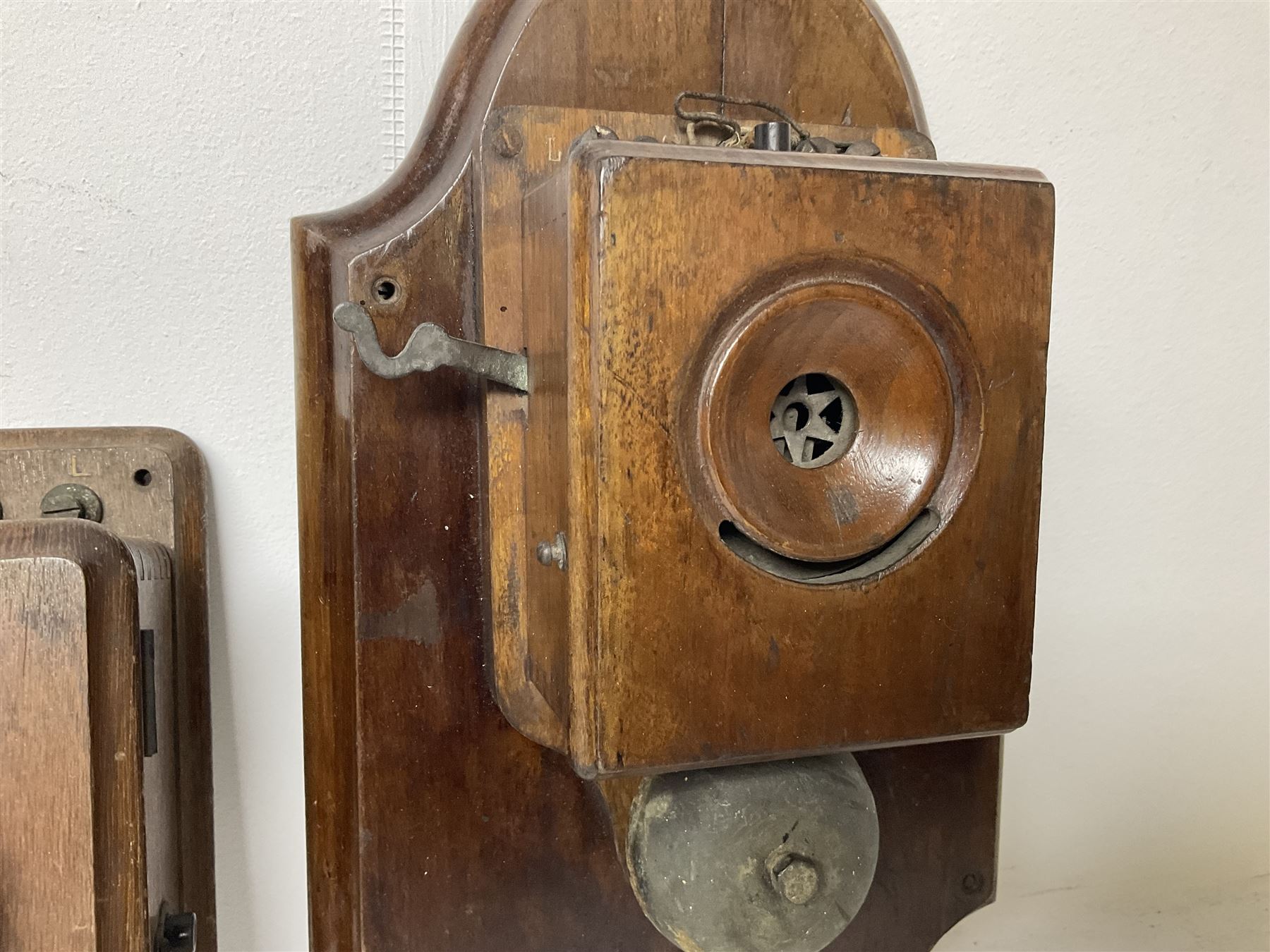 Two Hunningscone patent wall mounting telephones in walnut casing, together with Sterling Telephone & Electric Co. Ltd early wall-mounted telephone 'Primax' and one other 