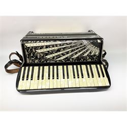 Italian Mantovani piano accordion with Art Deco style black and white case, twenty-four keys and one-hundred and twenty buttons L52cm in carrying case