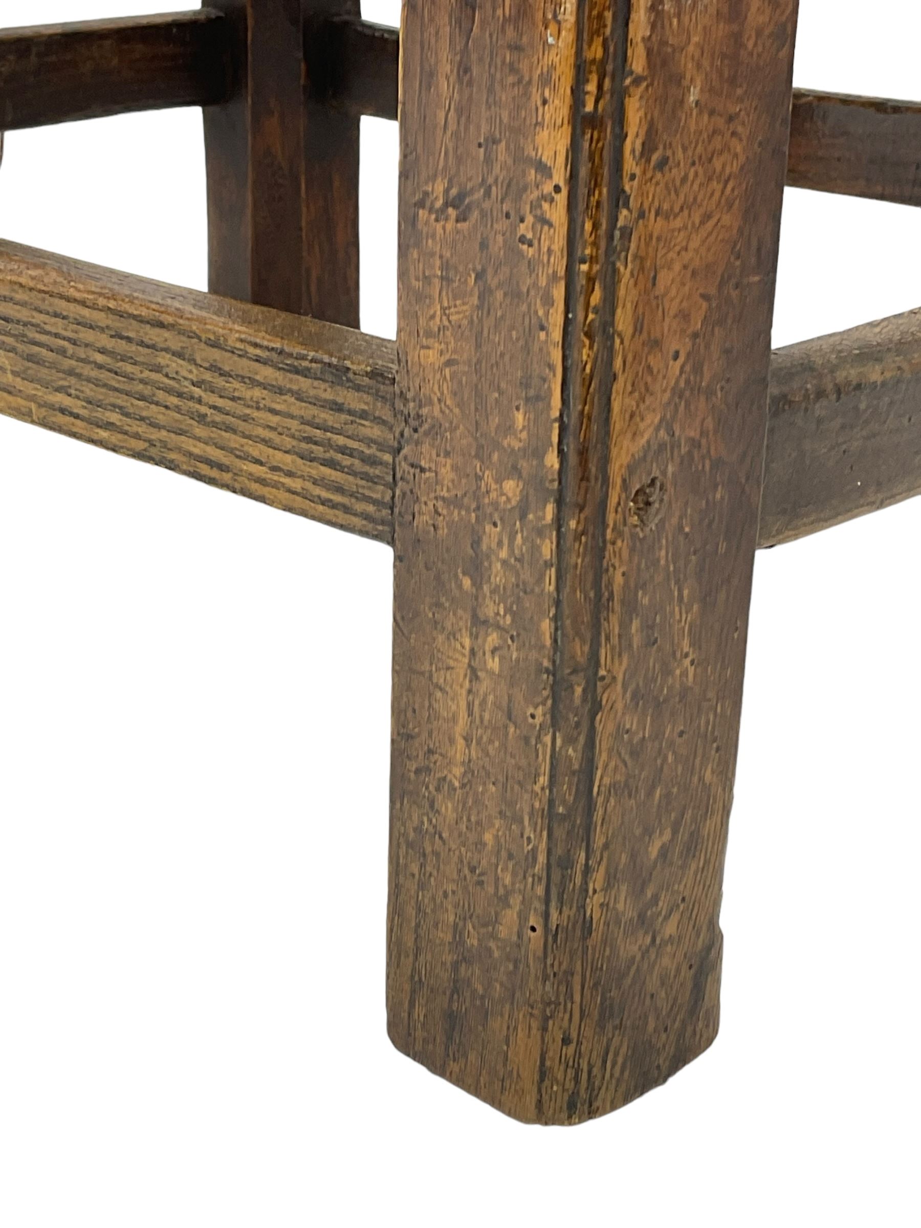 20th century mahogany rectangular footstool, needlework upholstered drop-in seat, on ball and claw carved feet (W81cm, D35cm, H34cm); 19th century elm stool, needlework upholstered drop-in seat, on square moulded supports united by plain stretchers (W45cm); 19th century walnut stool, shaped top upholstered in needlework, on cabriole supports (W50cm); 19th century rosewood stool, upholstered drop-in seat, on curved x-framed supports united by turned stretcher (W47cm)