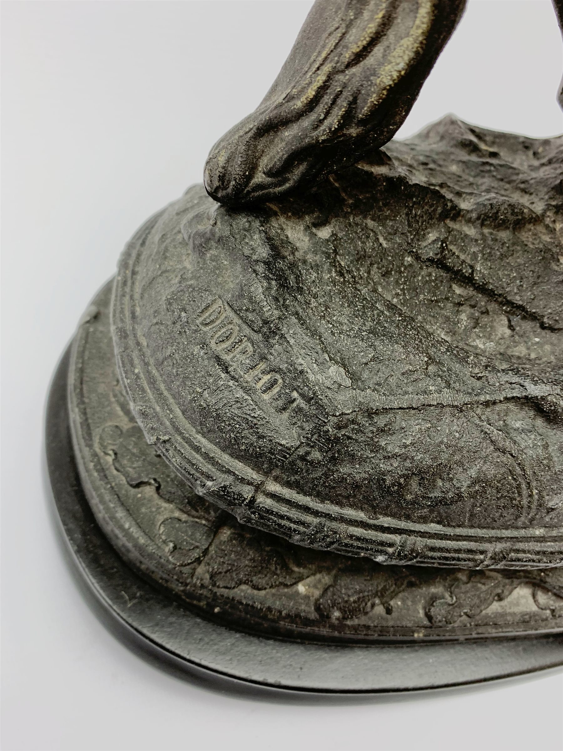 After Theodore Doriot, 19th century spelter figure of a barbarian warrior with spear and sword on a rearing horse, with battle trophies on the naturalistic base, H64cm including later ebonised wooden base