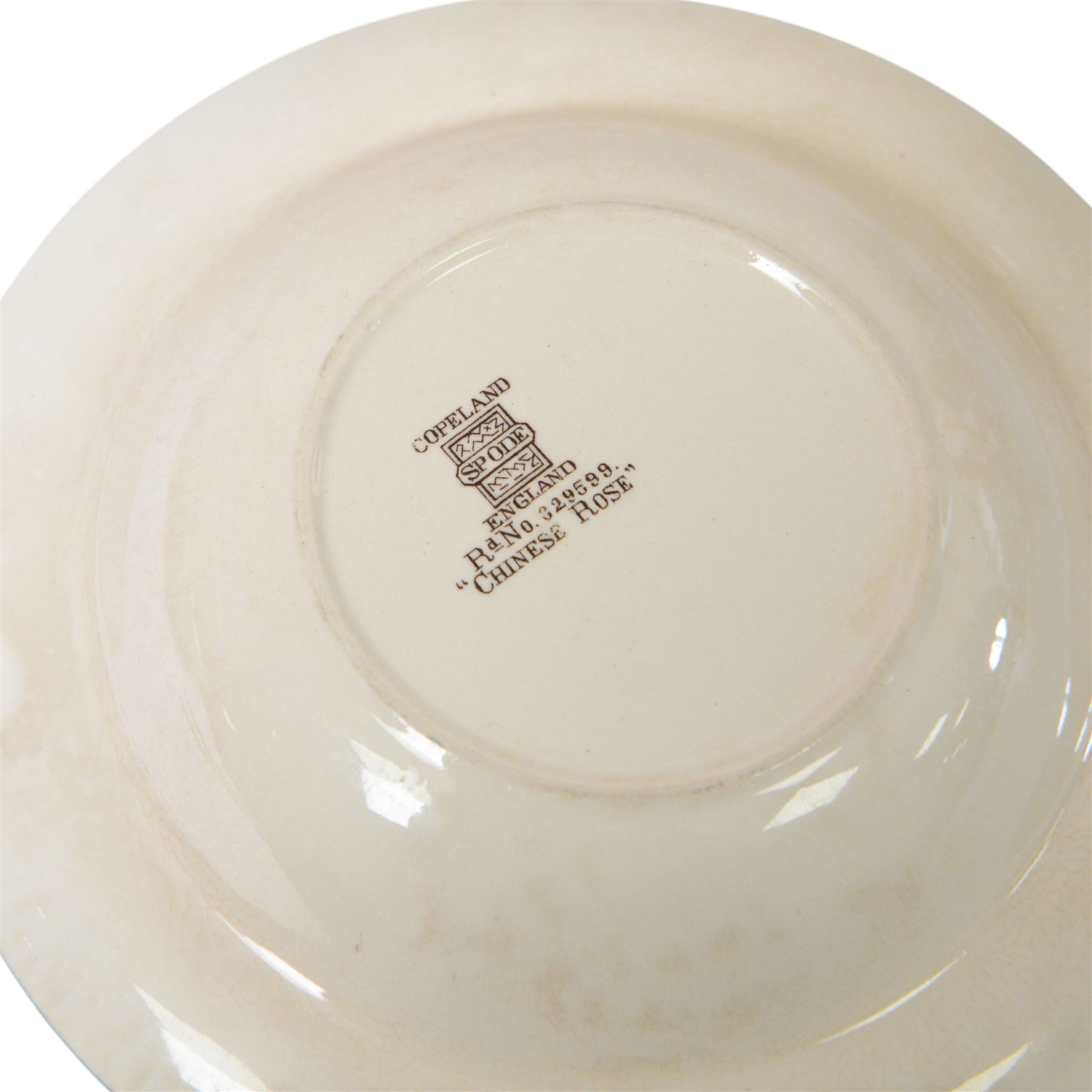 Spode Chinese Rose dinner service, including fourteen dinner plates, twelve side plates, teapot, milk jug, covered butter dish, serving platters etc 