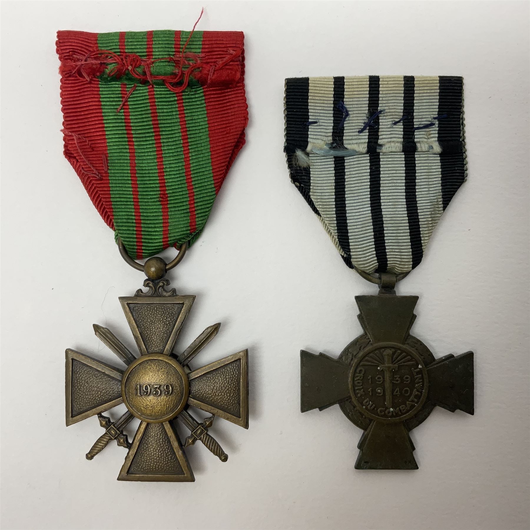 Four French medals - St. Helena medal with bust of Napoleon to obverse and inscription to reverse 'Campagnes de 1792 a 1815. A ses compagnons de gloire sa derniere pensée Ste. Hélène 5 Mai 1821', established by Emperor Napoleon III in 1857; two WW2 Croix-de-Guerre; and WW2 Croix-du-Combattant; all with ribbons (4)