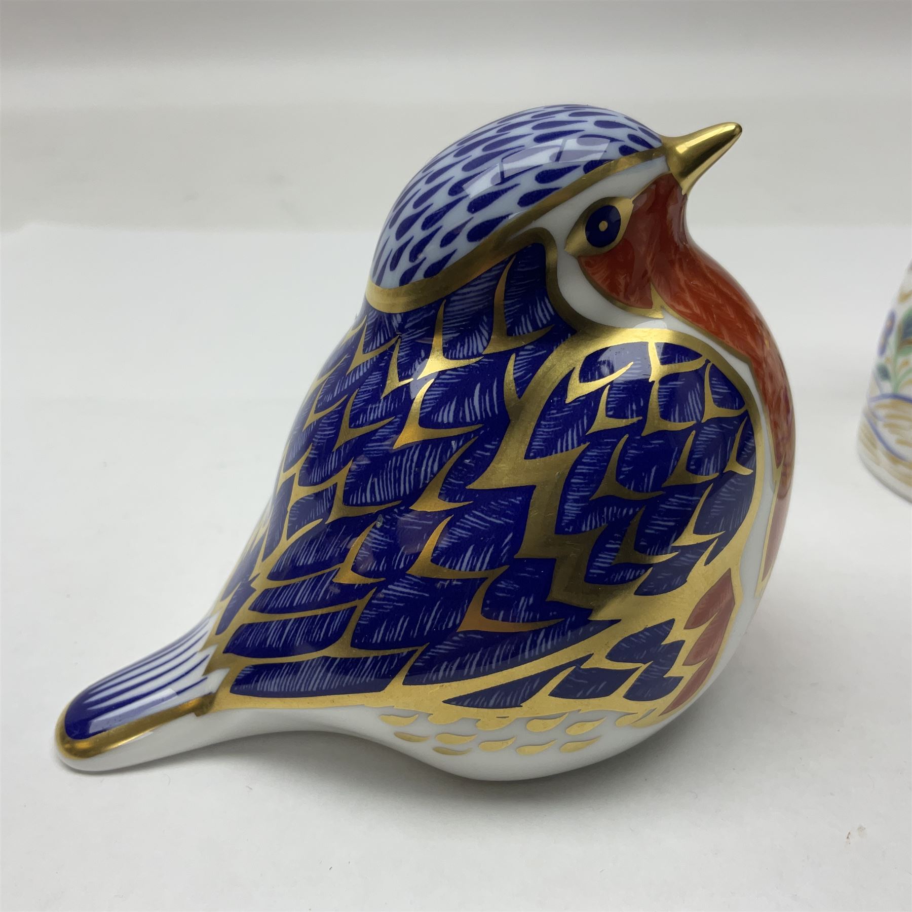 Two Royal Crown Derby paperweights, comprising Kingfisher, 2010 edition with gold stopper and Robin, with gold stopper