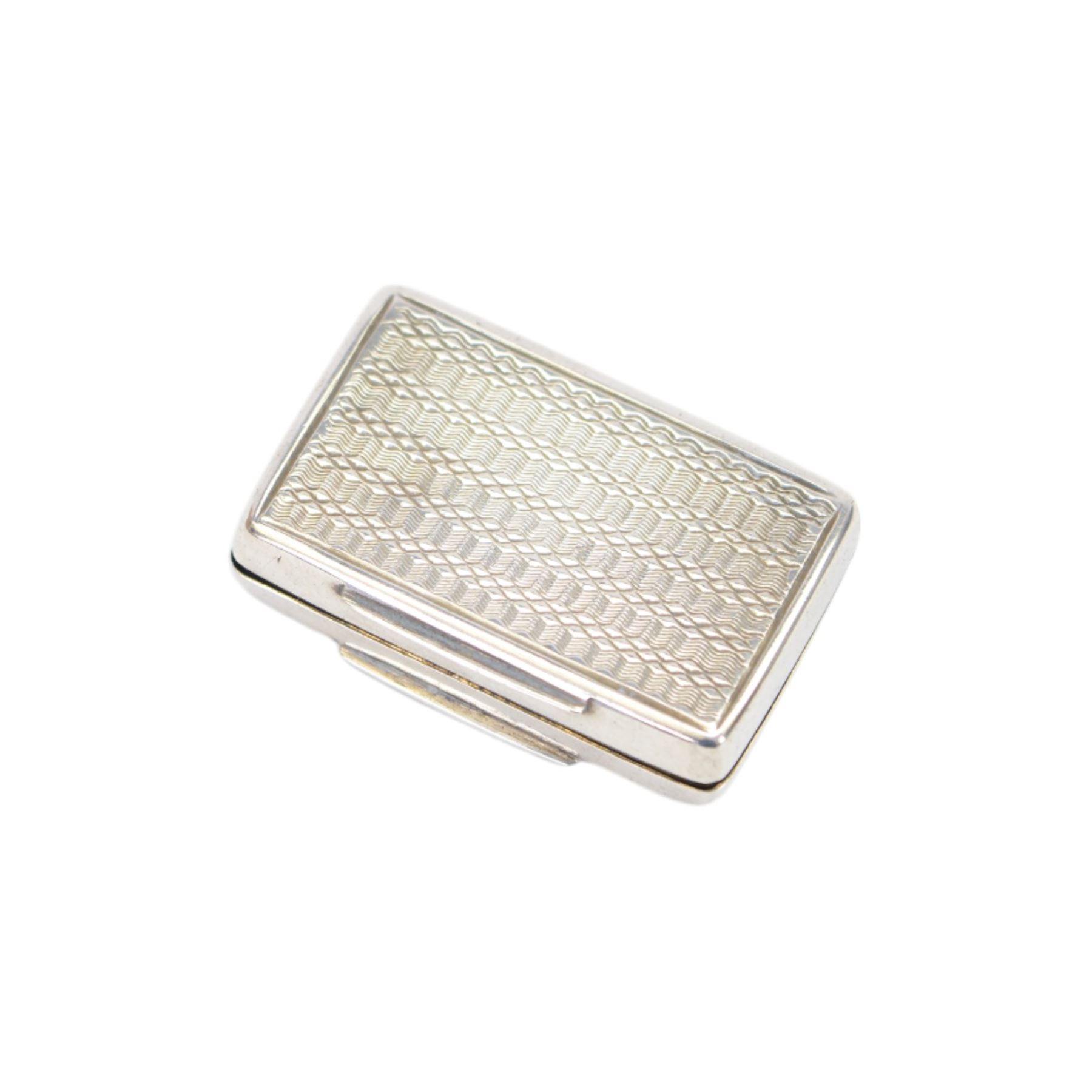 William IV silver vinaigrette, of rectangular form with engine turned decoration to hinged cover, opening to reveal gilt interior with engraved hinged compartment, hallmarked Francis Clark, Birmingham 1838, L3.5cm