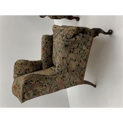 Matched pair early 20th century Queen Anne style wingback armchairs, walnut framed, sprung seats with seat cushions upholstered in needle work cover, shell carved cabriole front feet