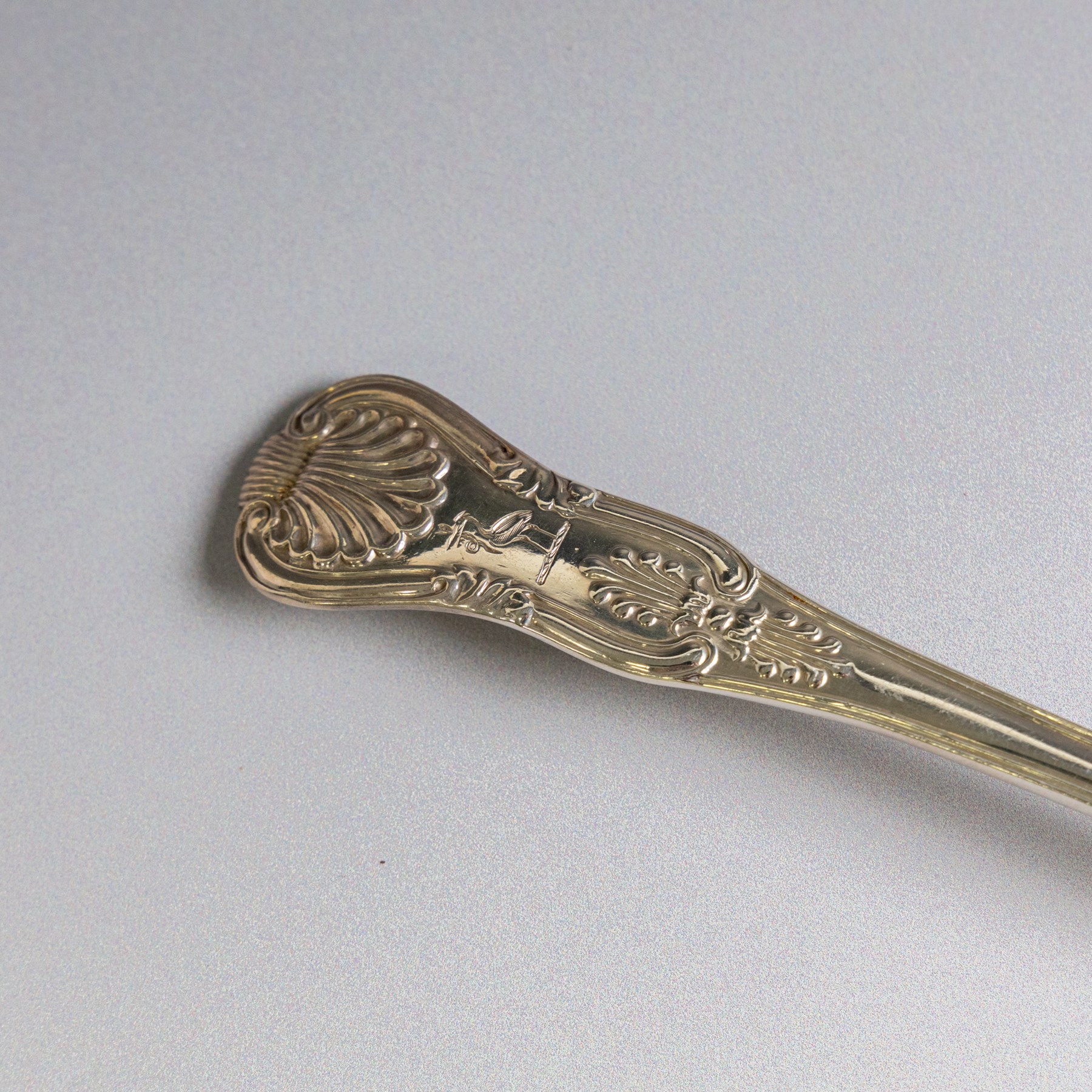 Four silver Kings pattern table spoons, comprising George IV pair, engraved with stork and serpent crest, hallmarked William M Traies, London 1827 and a Victorian pair, hallmarked Mary Chawner, London 1838
