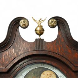 Rea of Walton on Trent (Derbyshire)-8-day Oak cased Longcase clock c1810, case with a swan necked pediment, brass parterre and a ball and eagle brass finial, bespoke hood door flanked by reeded pilasters with brass capitals, trunk with conforming recessed quarter columns and twin spire topped door, on a square plinth with canted corners and an optional detached base, comparatively rare painted oval dial with gesso decorated spandrels and a moon dial to the arch, chapter with Roman numerals, minute markers and Arabic quarter minutes, matching stamped brass hands with a subsidiary seconds dial and date aperture, dial pinned via an 