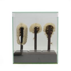 Judge's regalia, including, barrister’s wig in tin monogrammed J.A.W, Ede and Ravenscroft gown, tin of collars, jacket and waistcoat by Daniel Drescott, a glass case containing three miniature legal wigs; barrister’s wig, judge’s full bottom wig and bench wig and four Vanity Fair Spy prints