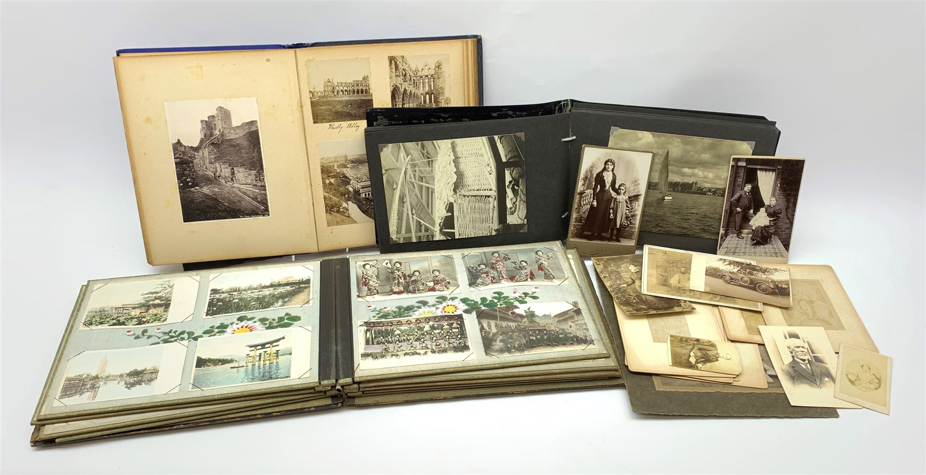 Early 20th century Japanese postcard album, the lacquered wooden covers with shibayama panel to the front, partially stocked with fifty Japanese postcards; Victorian album containing fifty-six laid-in photographs of British & Continental topographical scenes; mid-20th century album of Norwegian photographs; and quantity of Victorian cabinet photographs etc