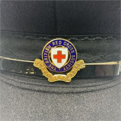 1950s British Red Cross North Yorkshire dress uniform comprising tunic, trousers, greatcoat and visor cap; bears manuscript label '1956 Ware'