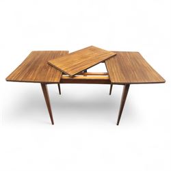 Richard Hornby for Fyne Ladye - mid-20th century afromosia teak dining table, tapered rectangular top with fluted edge and recess for spare leaf, raised on slender legs, four teak framed chairs, of ladder back design, with drop-in seat, upholstered seat, with tapered front legs and slightly raked rear legs,, table unextended width 106cm depth 79cm height 74cm with additional leaf 45cm wide- chairs width 48cm depth 41cm height 87cm 