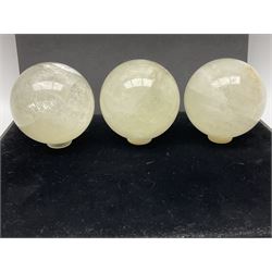 Set of three clear calcite spheres, D8cm