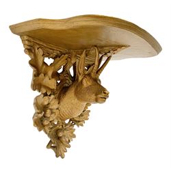 Late 20th century carved giltwood wall bracket, the shaped top with carved support in the form of a deer amidst oak leaves and acorns, H33.5cm