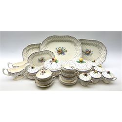 Copeland Spode Polka Dot pattern dinner and tea wares, comprising four dinner plates, seven salad plates, four dessert plates, six twin handled soup bowls and two saucers, six chocolate cups with covers and six saucers, two sauce boats, two tureens and covers, and four graduated serving platters. 
