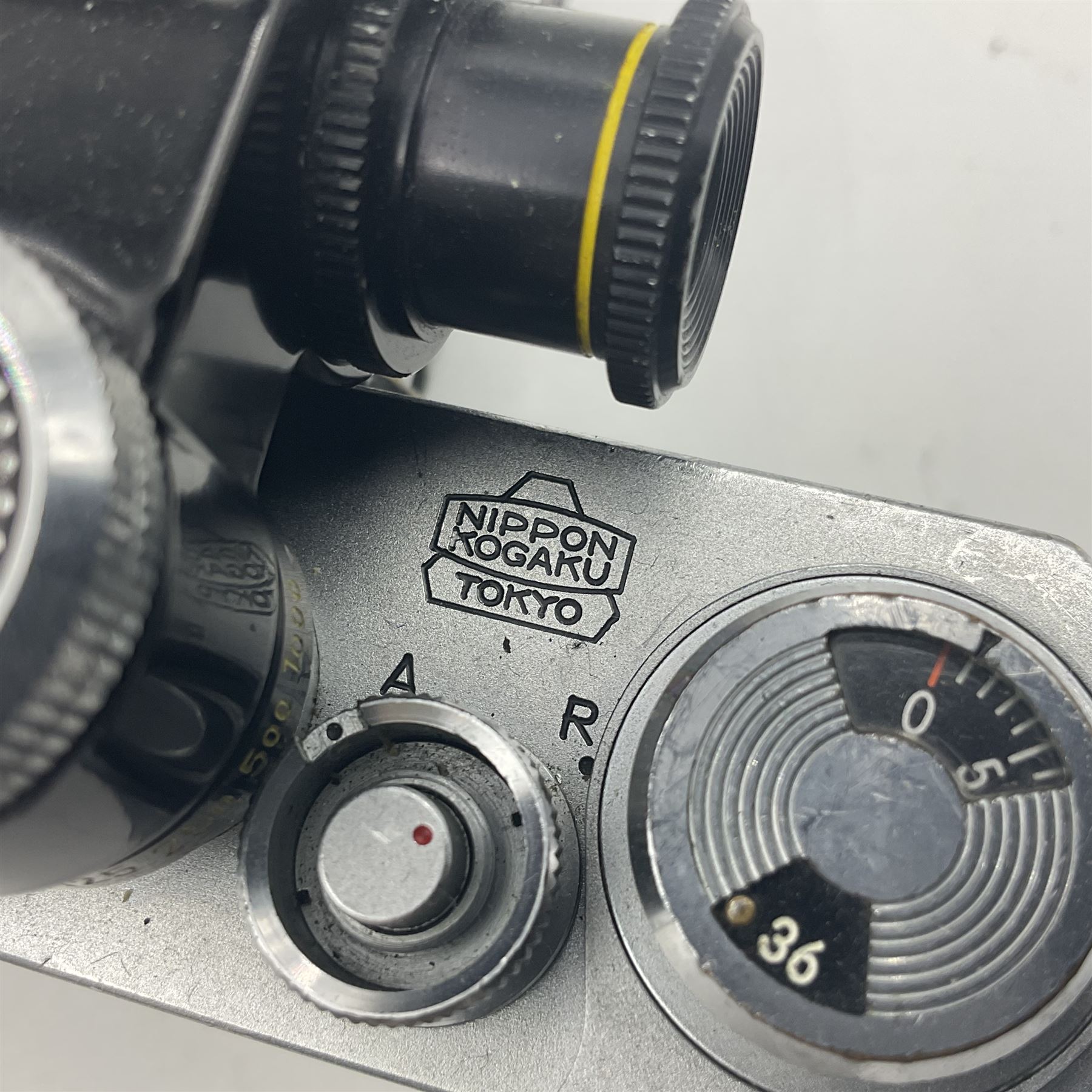 Nikon F Photomic NKJ camera body, marked 'US Dept of Defense ... U.S.A.F DA Nang, serial no. 6561811, with 'Nippon Kogaku NIKKOR-P Auto 1:2.5 f=105mm' lens, serial no. 212154