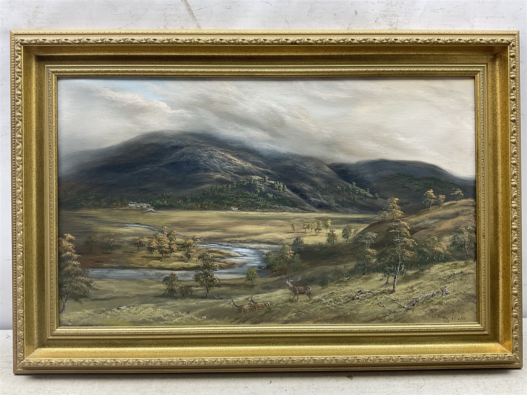 Willie Forbes (Scottish Contemporary): Stag and Deer in the Highlands, oil on canvas signed and dated '99, 34cm x 57cm 