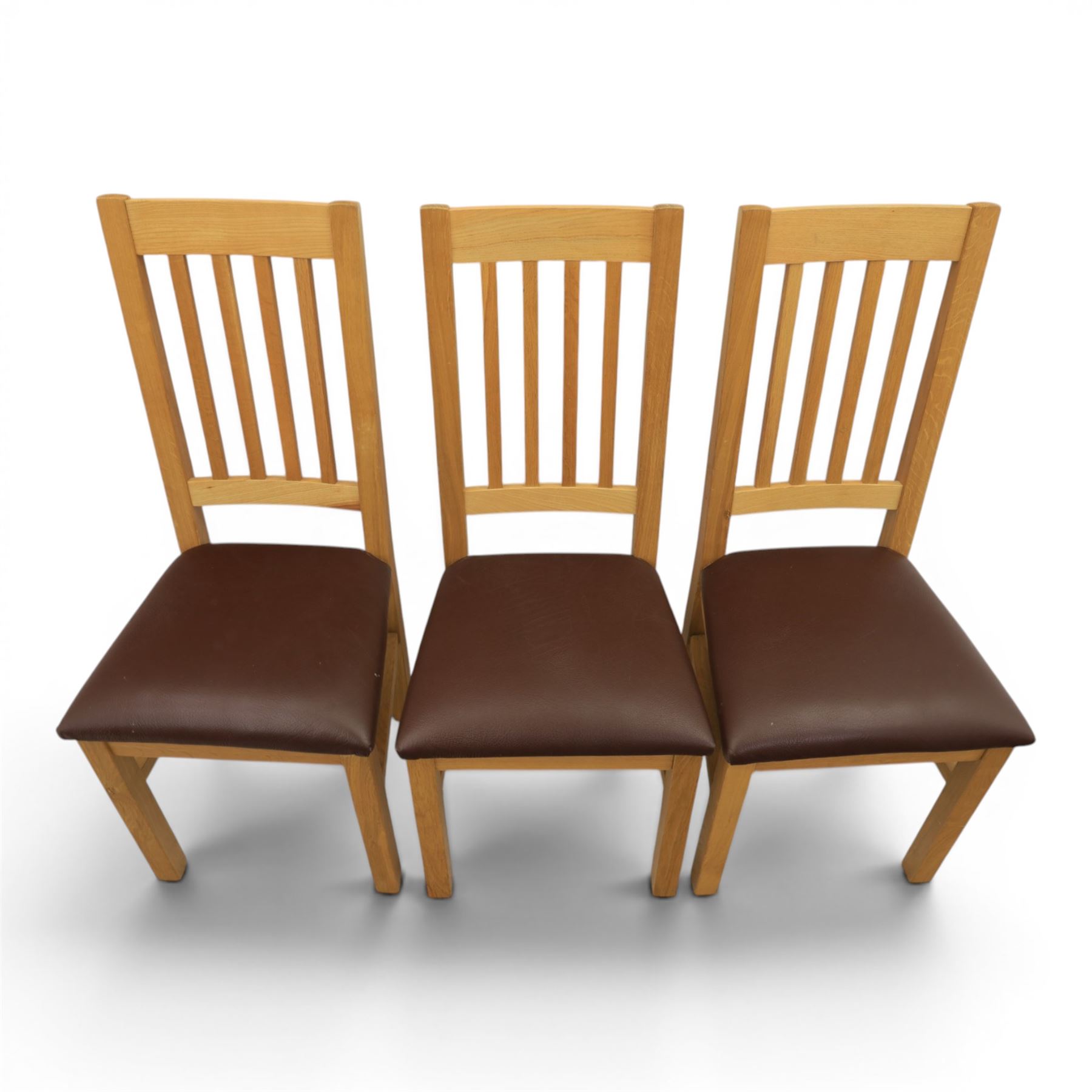 Modern solid oak dining table with set six chairs, chairs with brown leatherette seat