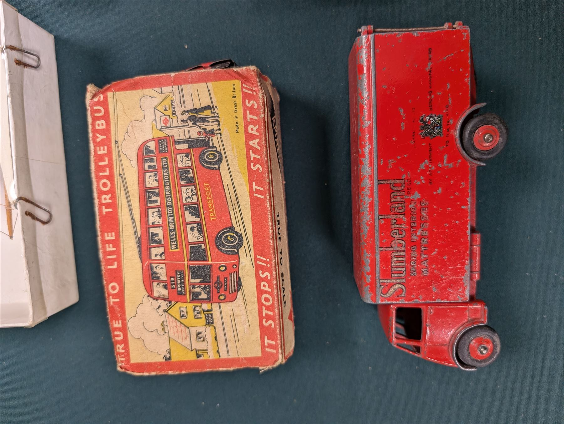 Small collection of model vehicles, including tin-plate trolley bus, Dinky Guy lorry, Triang Pedigree Prams bus, etc