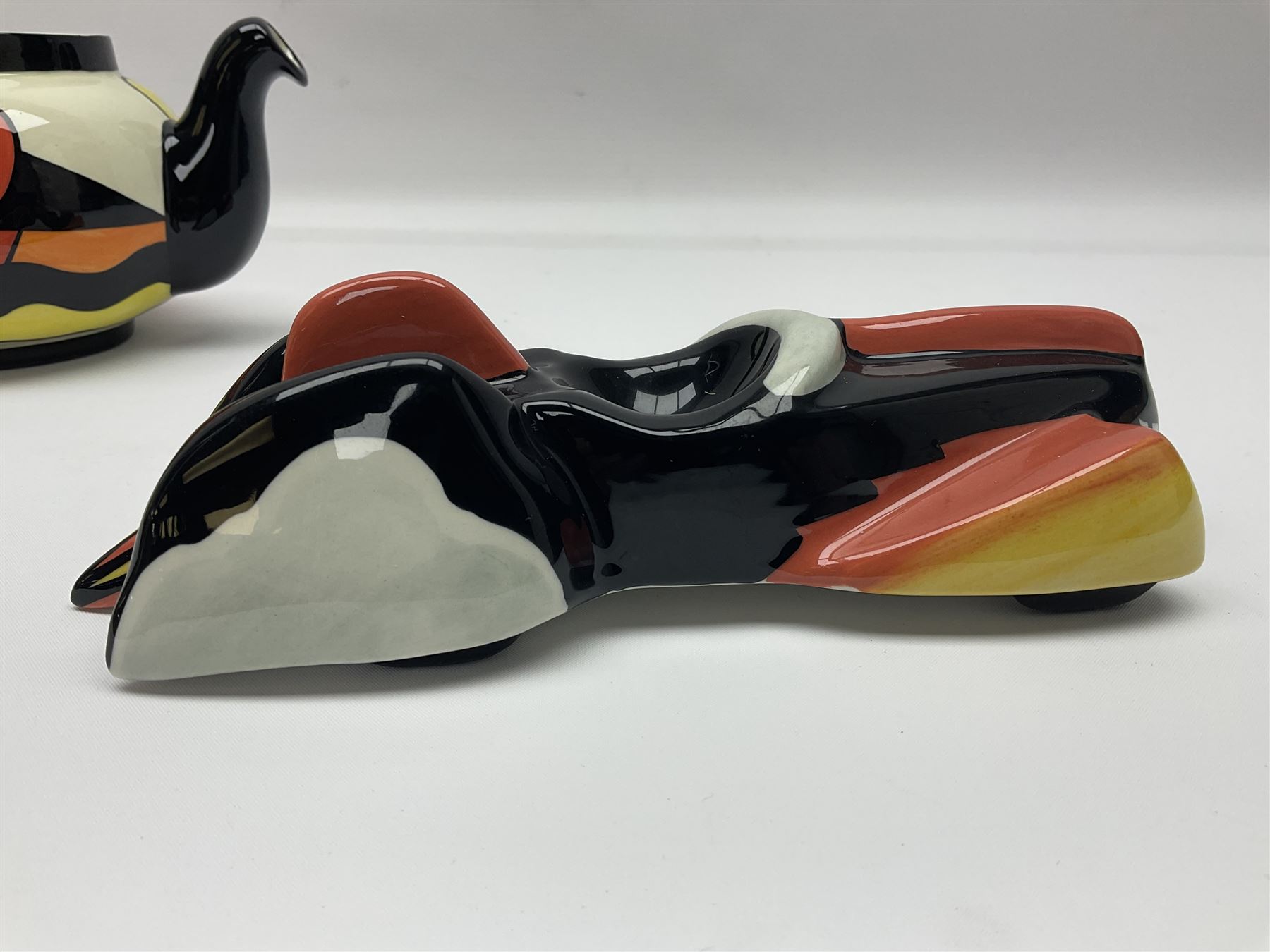 Lorna Bailey Mirage pattern teapot, together with Lorna Bailey batmobile egg cup, both signed beneath, teapot H10cm