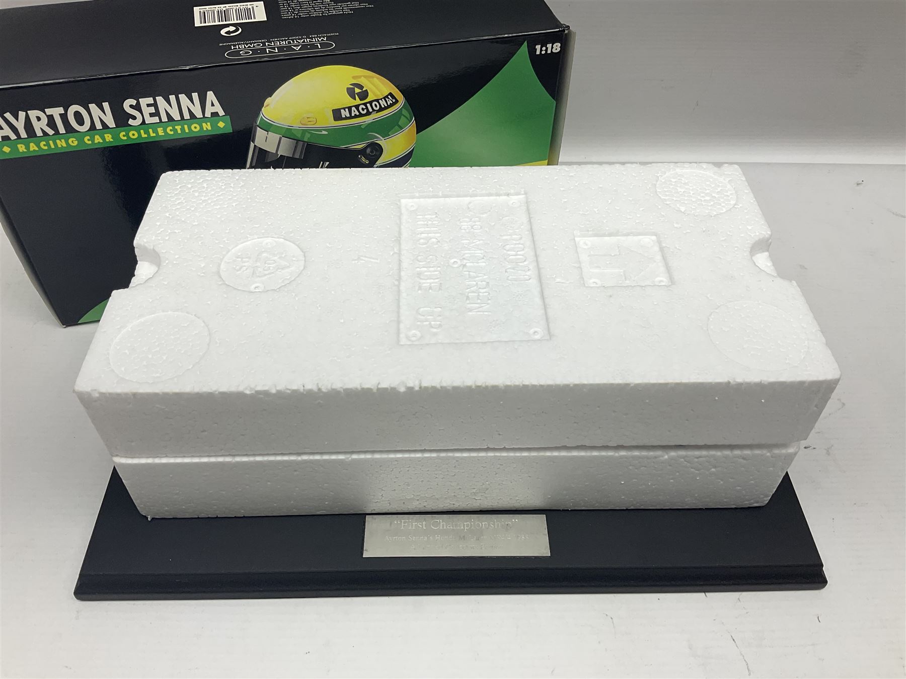 Ayrton Senna Racing Car Collection - McLaren MP4/4 1988 World Champion; boxed; with separate stand titled 'First Championship'